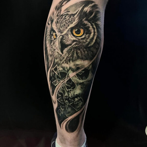 Black and Gray Owl and Skull Tattoo on Lower Leg