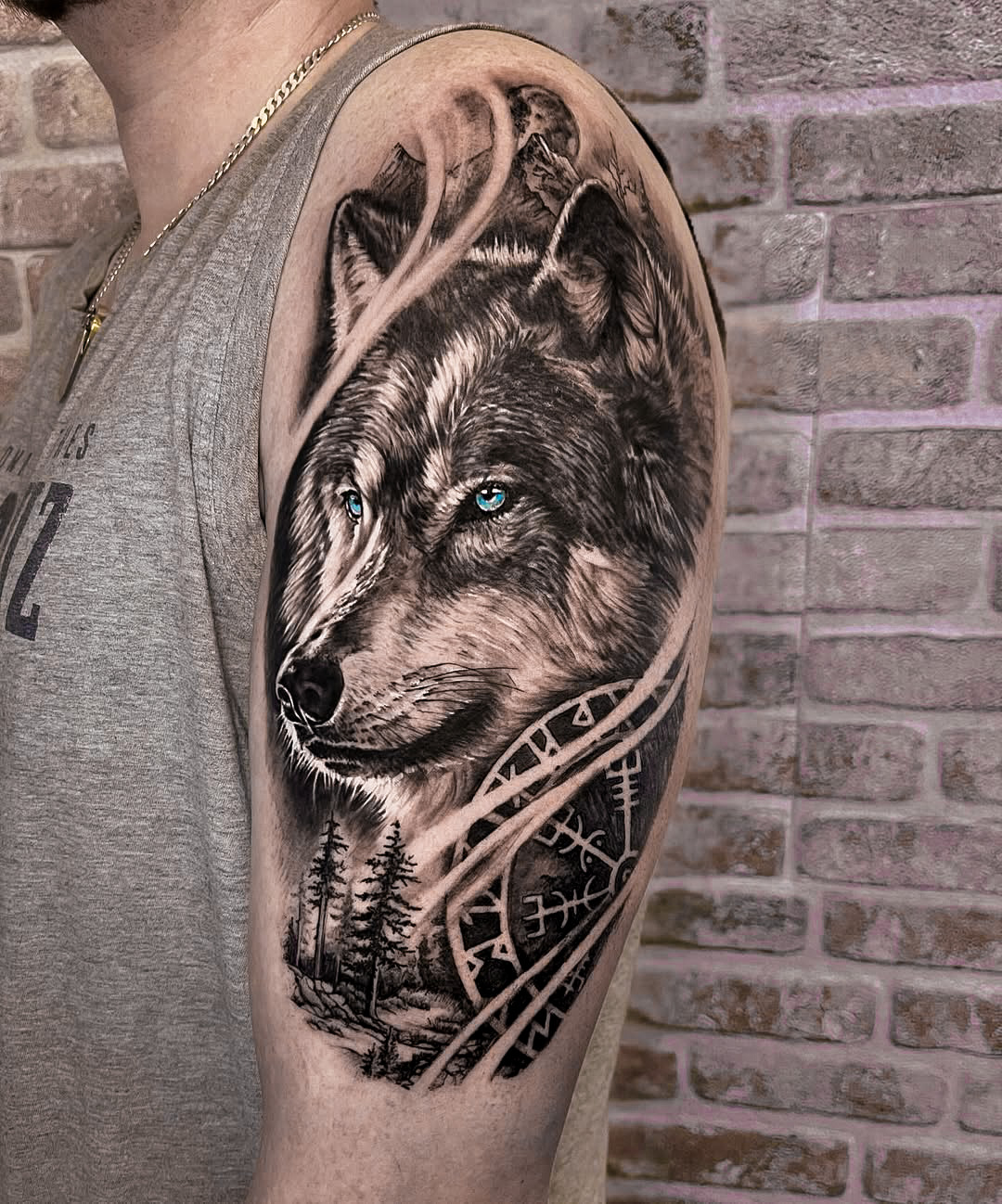 Wolf Tattoo on Upper Arm in Black and Gray