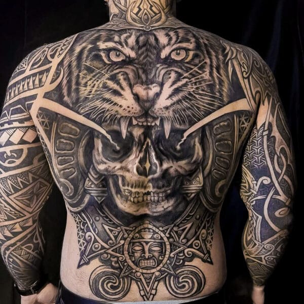 Full Back Tattoo Blending Tribal Patterns and Realism