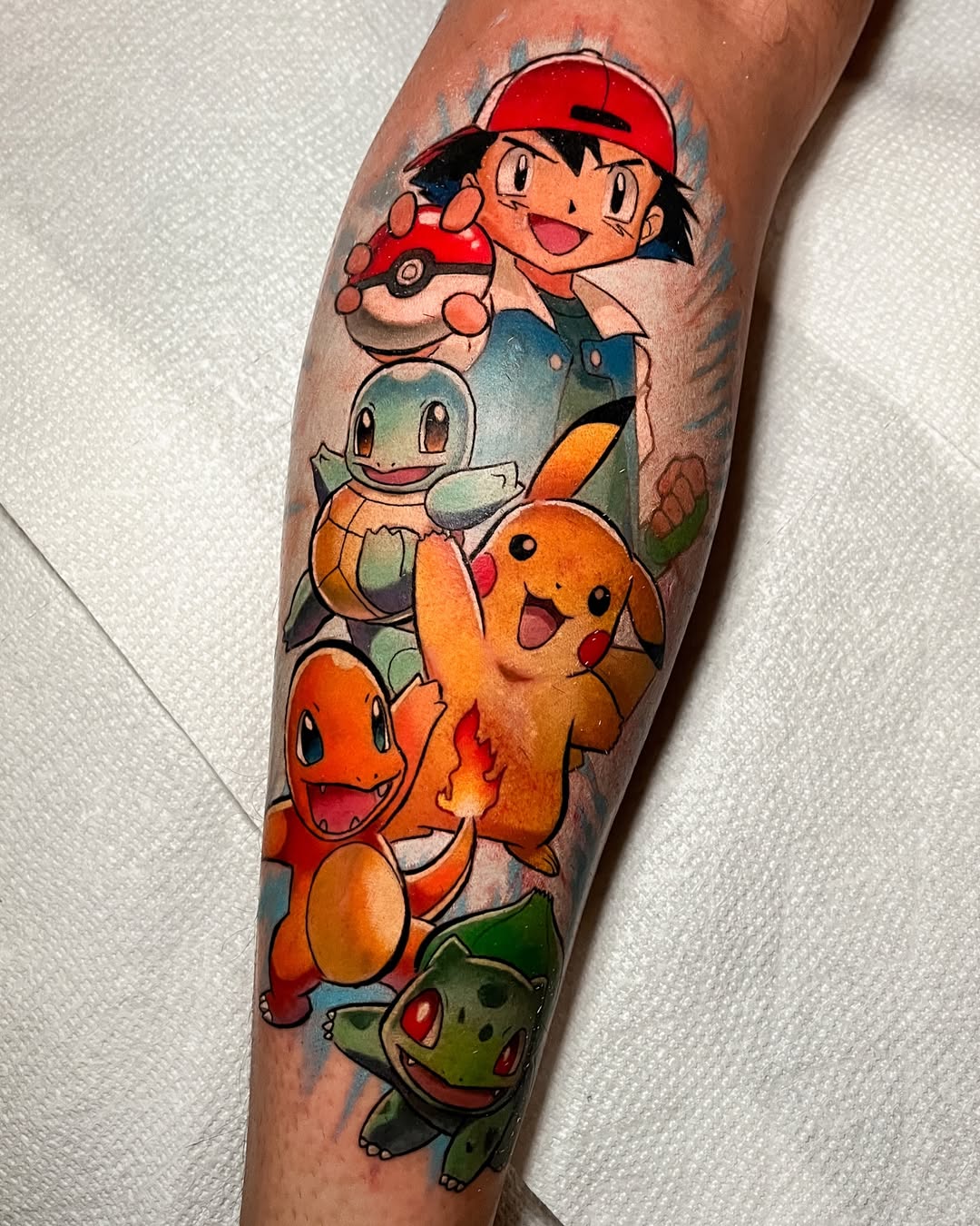 Bright Ash and Pokémon Team Tattoo on Forearm