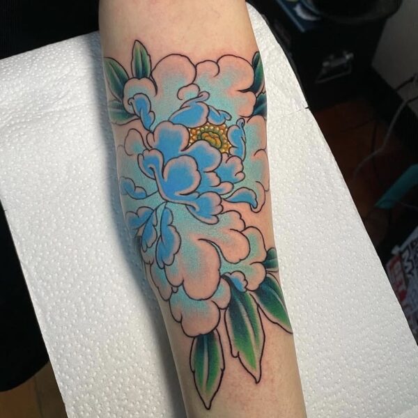 Blue Peony Tattoo on Arm in Traditional Style