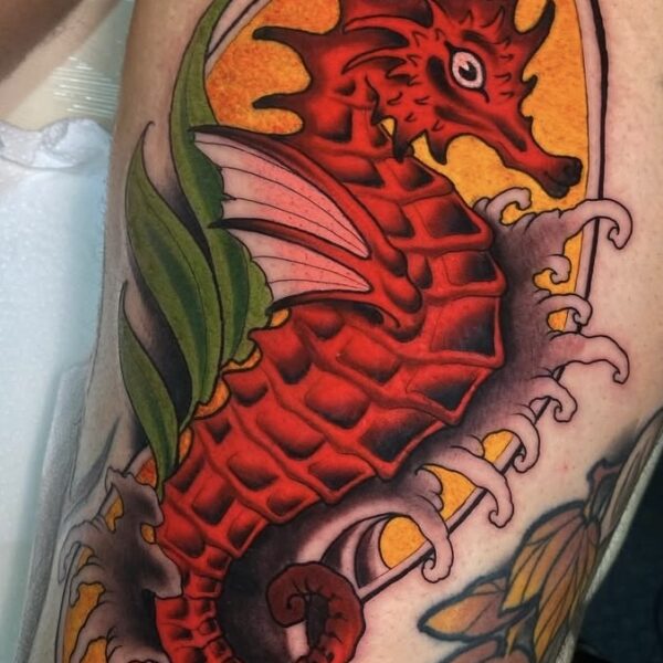 Vibrant Red Sea Horse Tattoo on Thigh