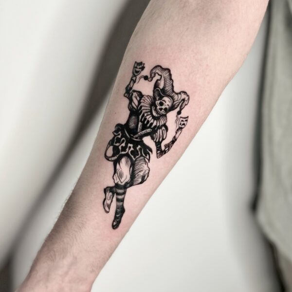 Black Jester Tattoo on Forearm