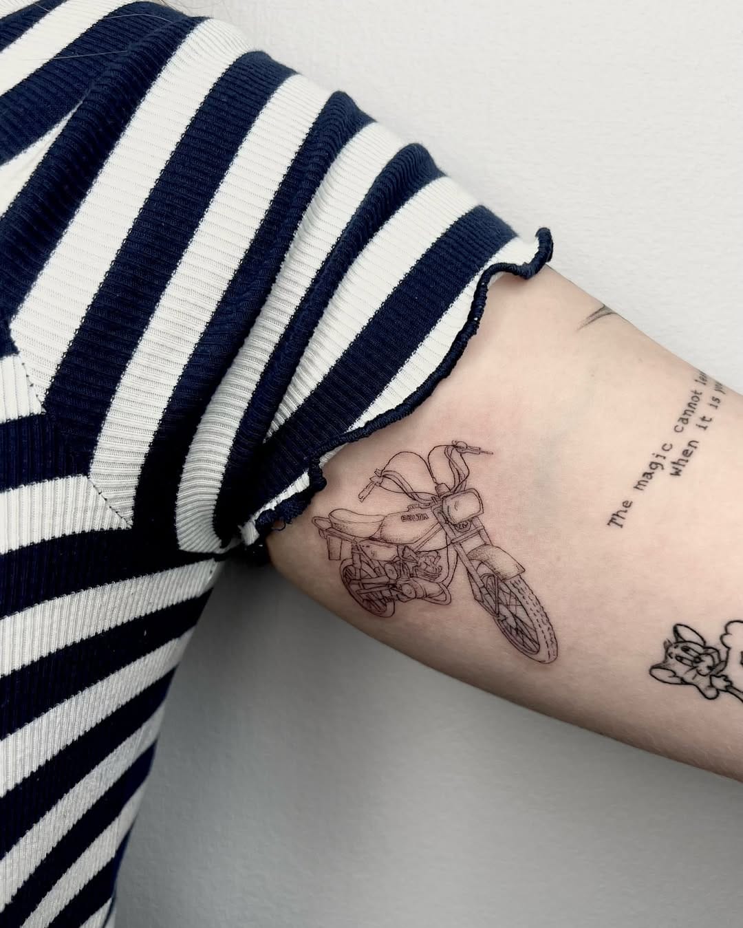 Minimalistic Motorcycle Tattoo on Biceps