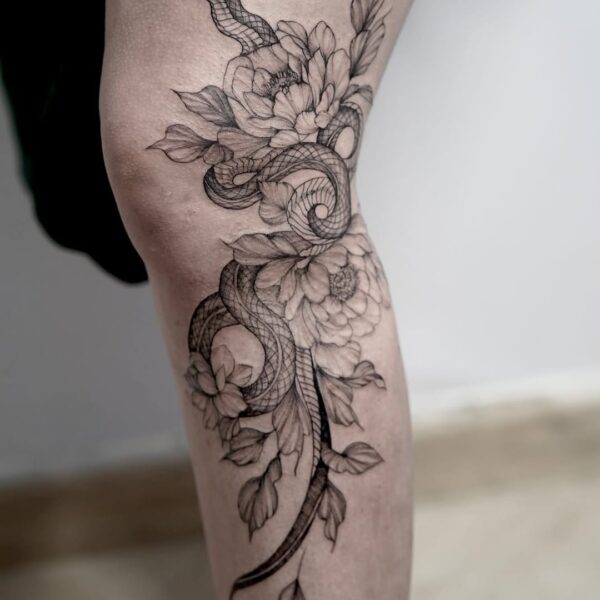 Delicate Snake and Floral Tattoo on Leg