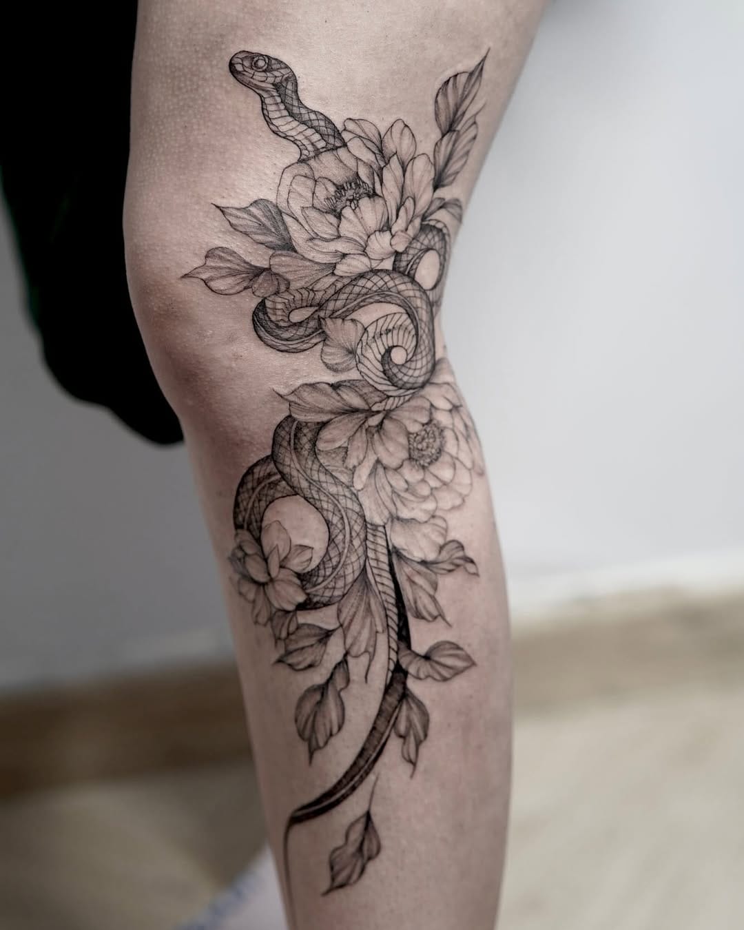Delicate Snake and Floral Tattoo on Leg