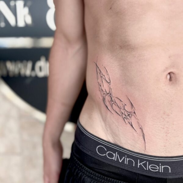 Cybercigilism Tattoo on Side of Stomach