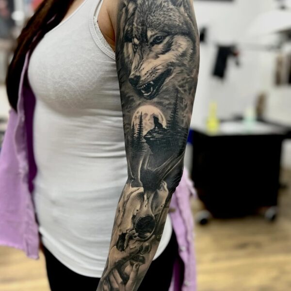 Black and Gray Sleeve Tattoo with Wolf and Forest