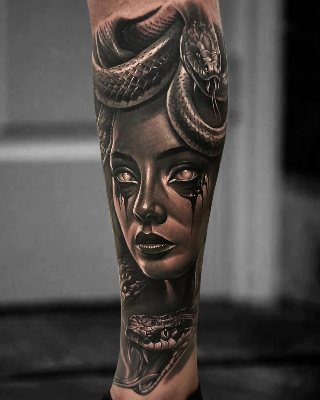 Black and Gray Realism Tattoo of Medusa on Lower Leg