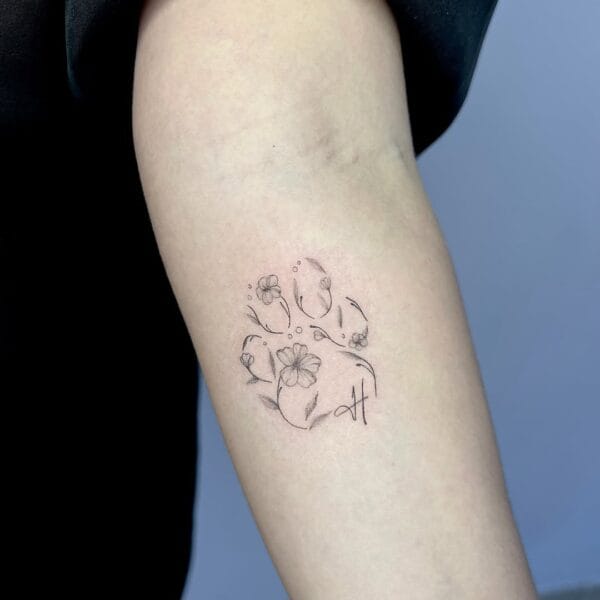 Floral Paw Print Tattoo in Gentle Linework