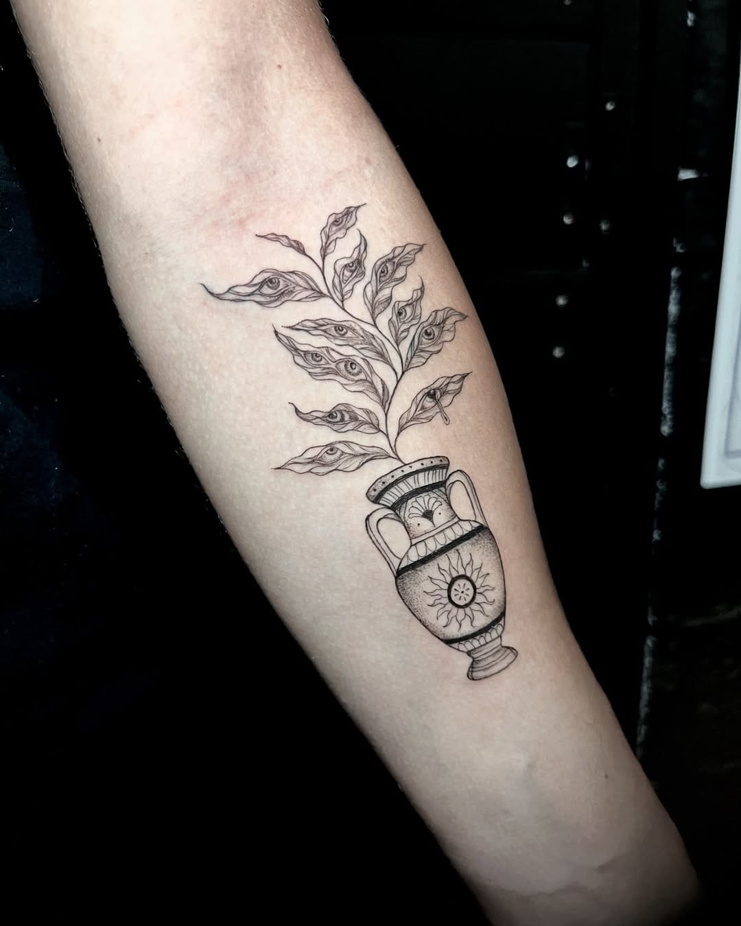 Minimalistic Vase with Plant Tattoo on Forearm