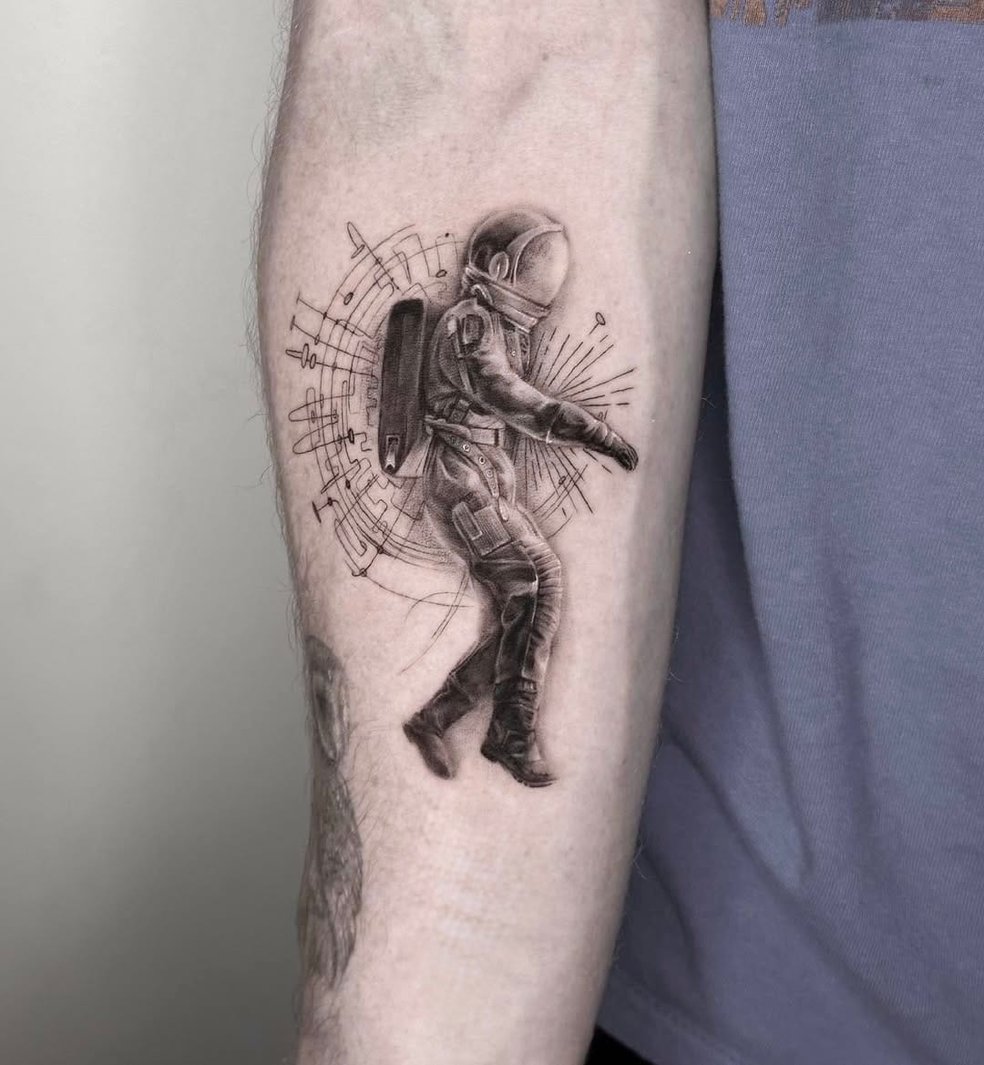 Astronaut Tattoo with Fine Line Details on Forearm