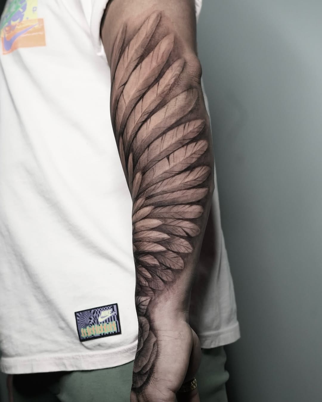 Wing and Rose Tattoo on Hand and Forearm