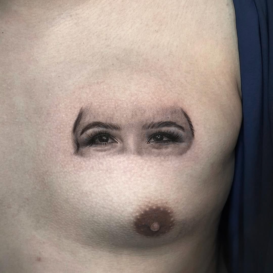 Black and Gray Eye Portrait Tattoo on Chest