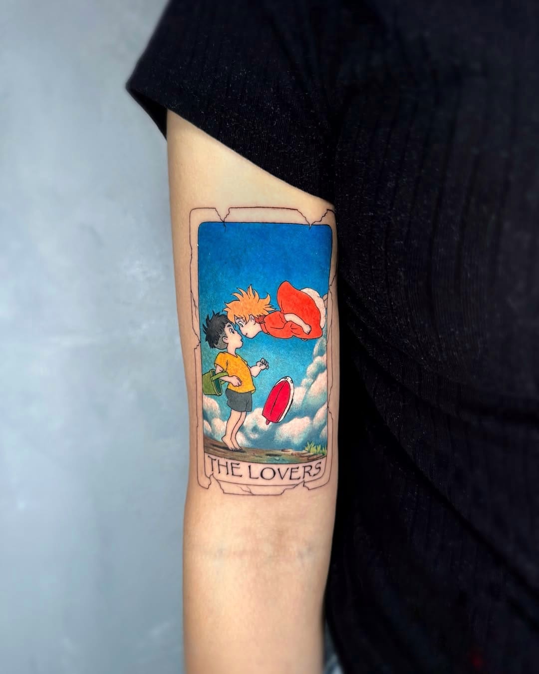 Ponyo and Sosuke Tattoo in Tarot Card Style on Upper Arm