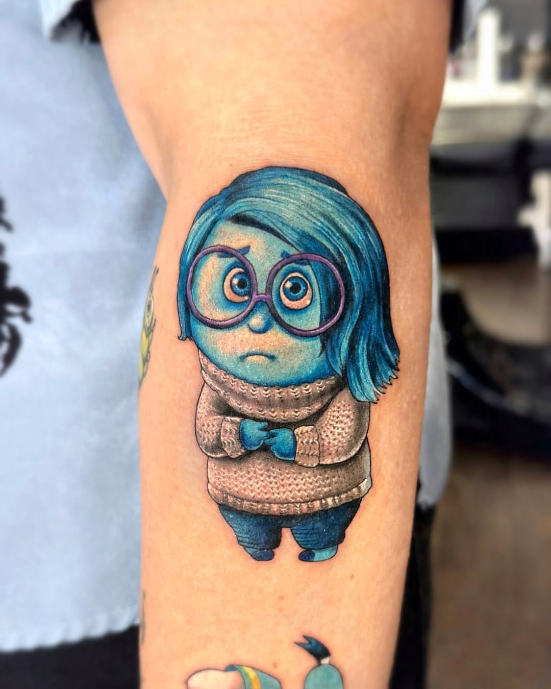 Inside Out Tattoo Sadness Character in Color on Forearm