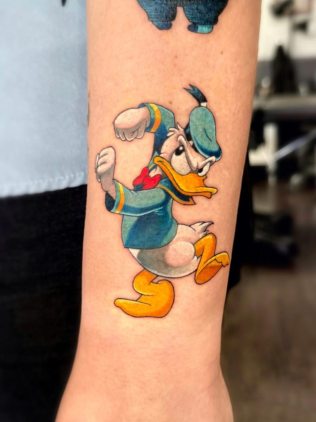 Vibrant Donald Duck Tattoo on Forearm