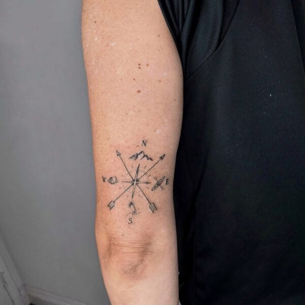 Minimalistic Traveler Tattoo with Mountains and Compass