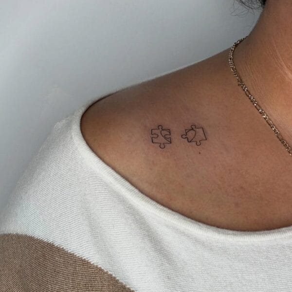 Minimalistic Puzzle Pieces Shoulder Tattoo