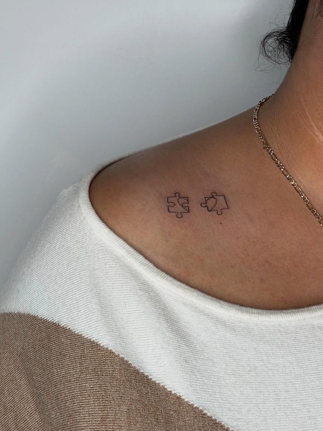 Minimalistic Puzzle Pieces Shoulder Tattoo