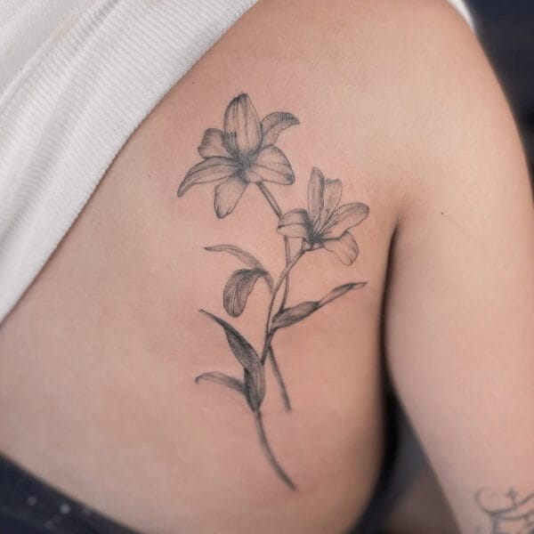 Delicate Lily Tattoo on Shoulder Blade