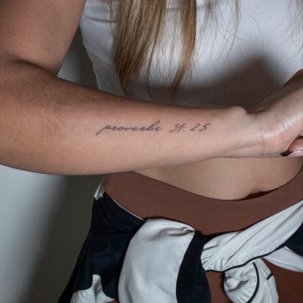 Gentle Script Tattoo On Side Of Forearm