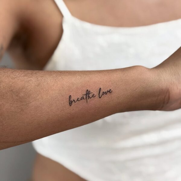 Quote Tattoo on Side of Forearm