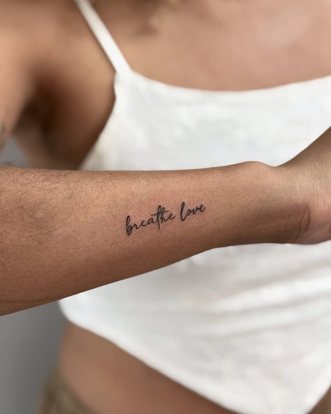Quote Tattoo on Side of Forearm