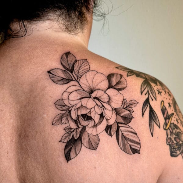 Delicate Fine Line Flower Tattoo on Shoulder Blade
