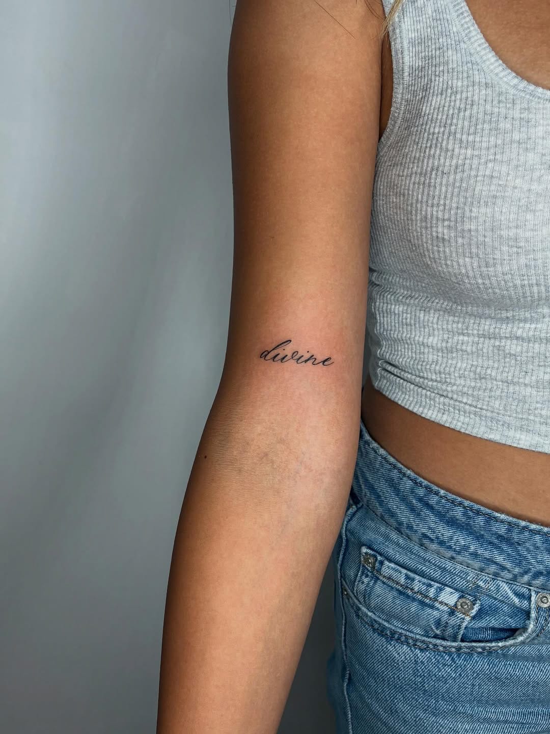 Small Forearm Lettering Tattoo