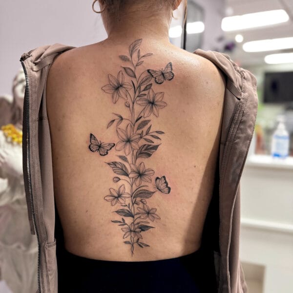 Delicate Flower Tattoo on Spine