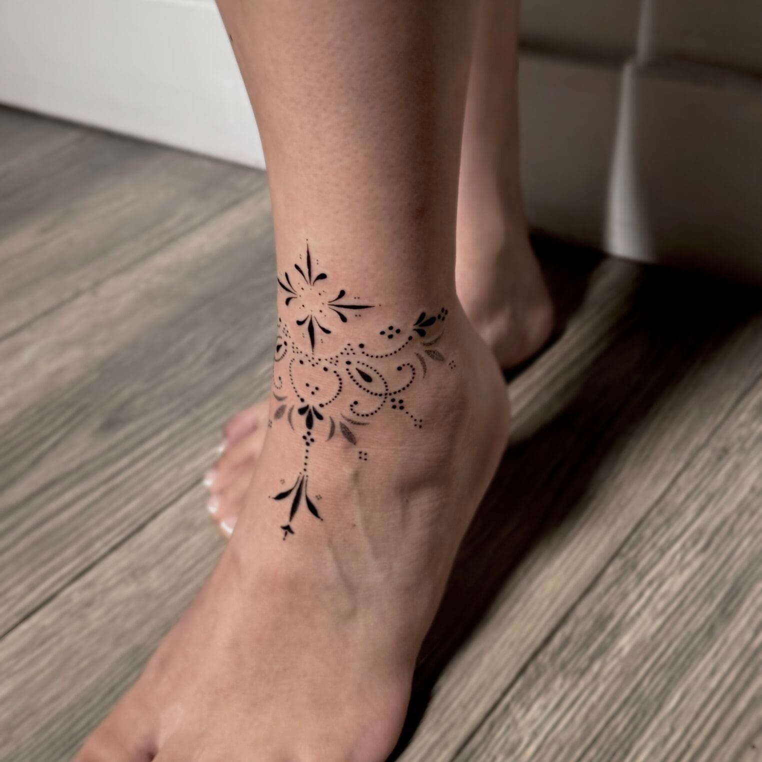 Delicate Ornamental Tattoo on Lower Leg