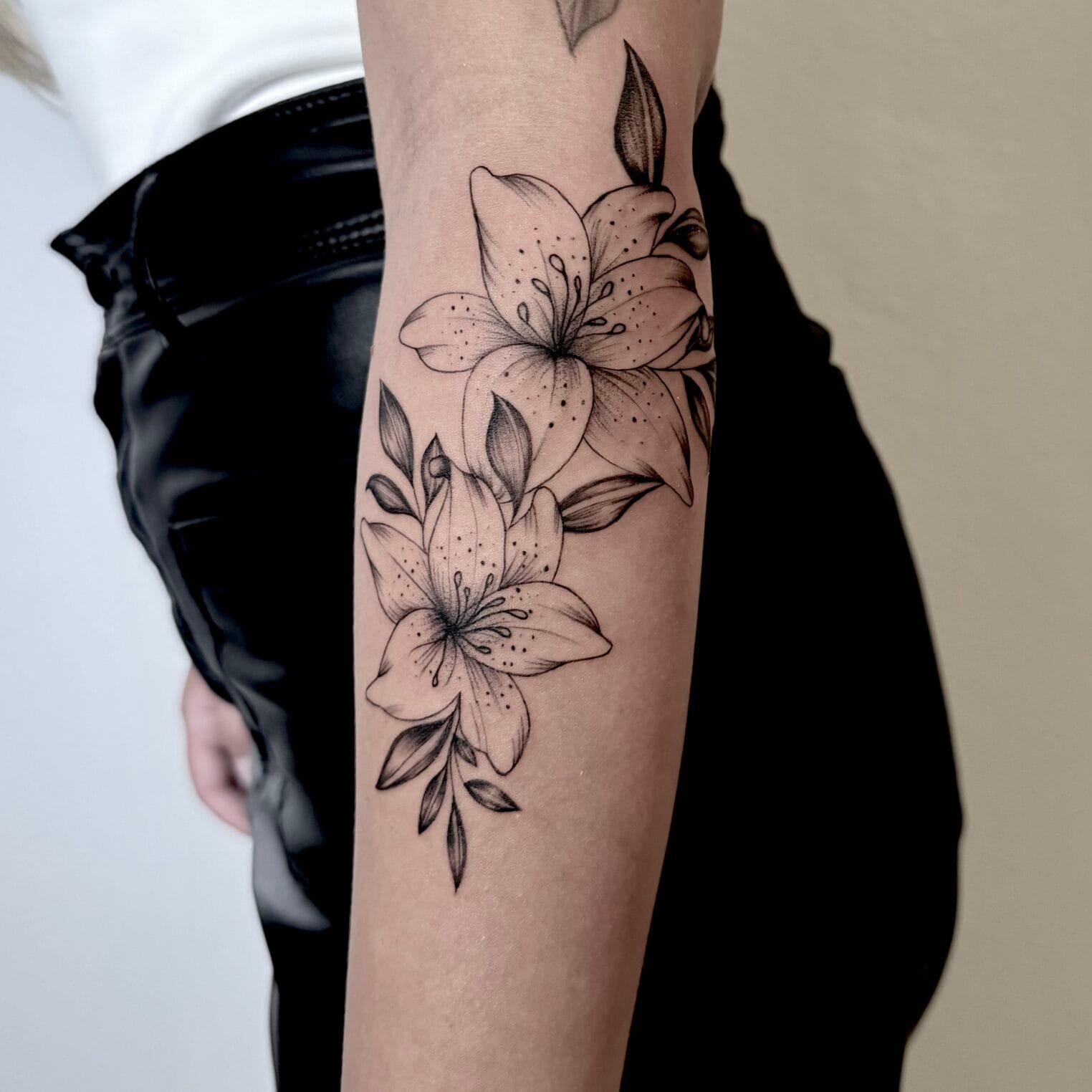 Gentle Fineline Lily Tattoo on Forearm