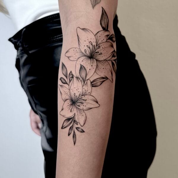 Gentle Fineline Lily Tattoo on Forearm