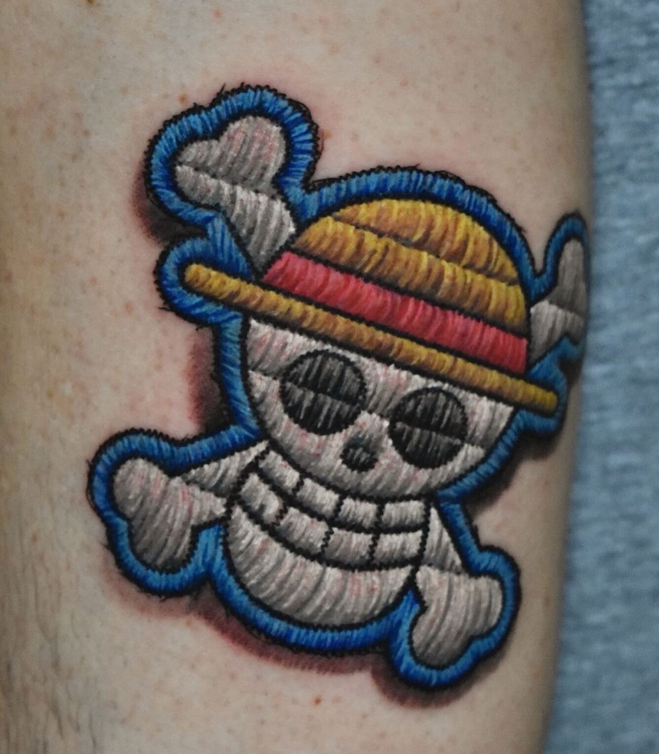 One Piece Skull Patch Tattoo on Leg