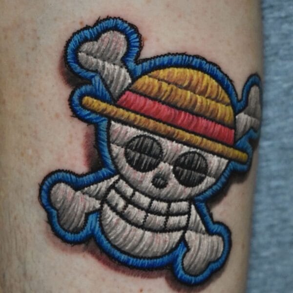 One Piece Skull Patch Tattoo on Leg