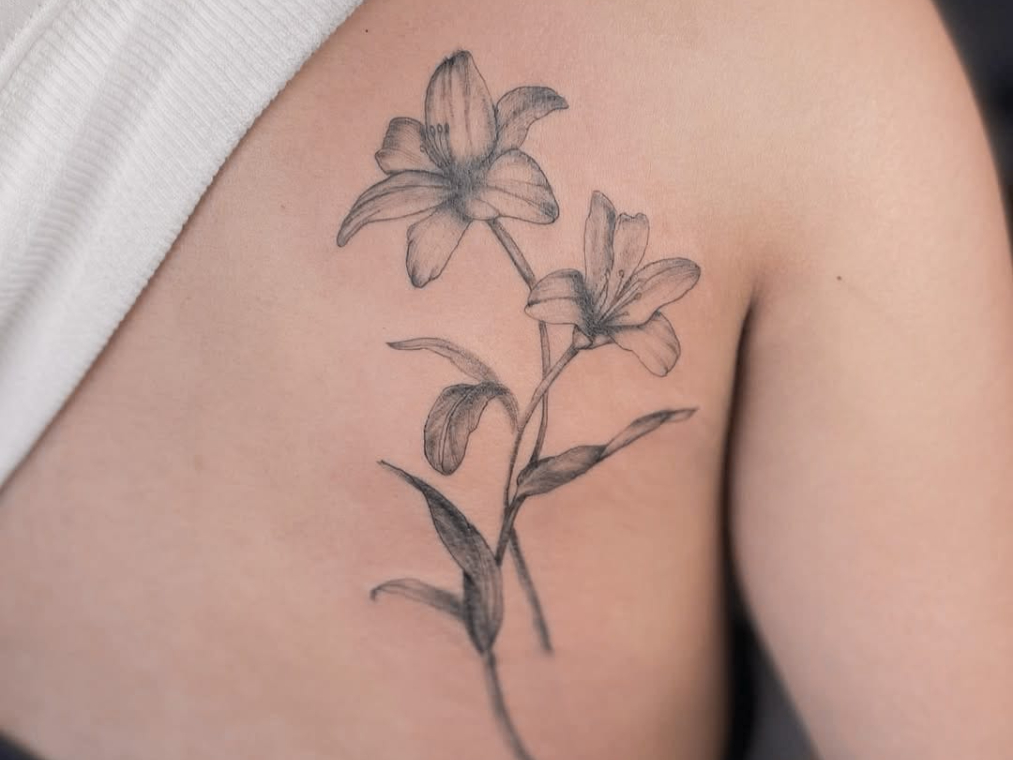 Delicate Lily Tattoo on Shoulder Blade