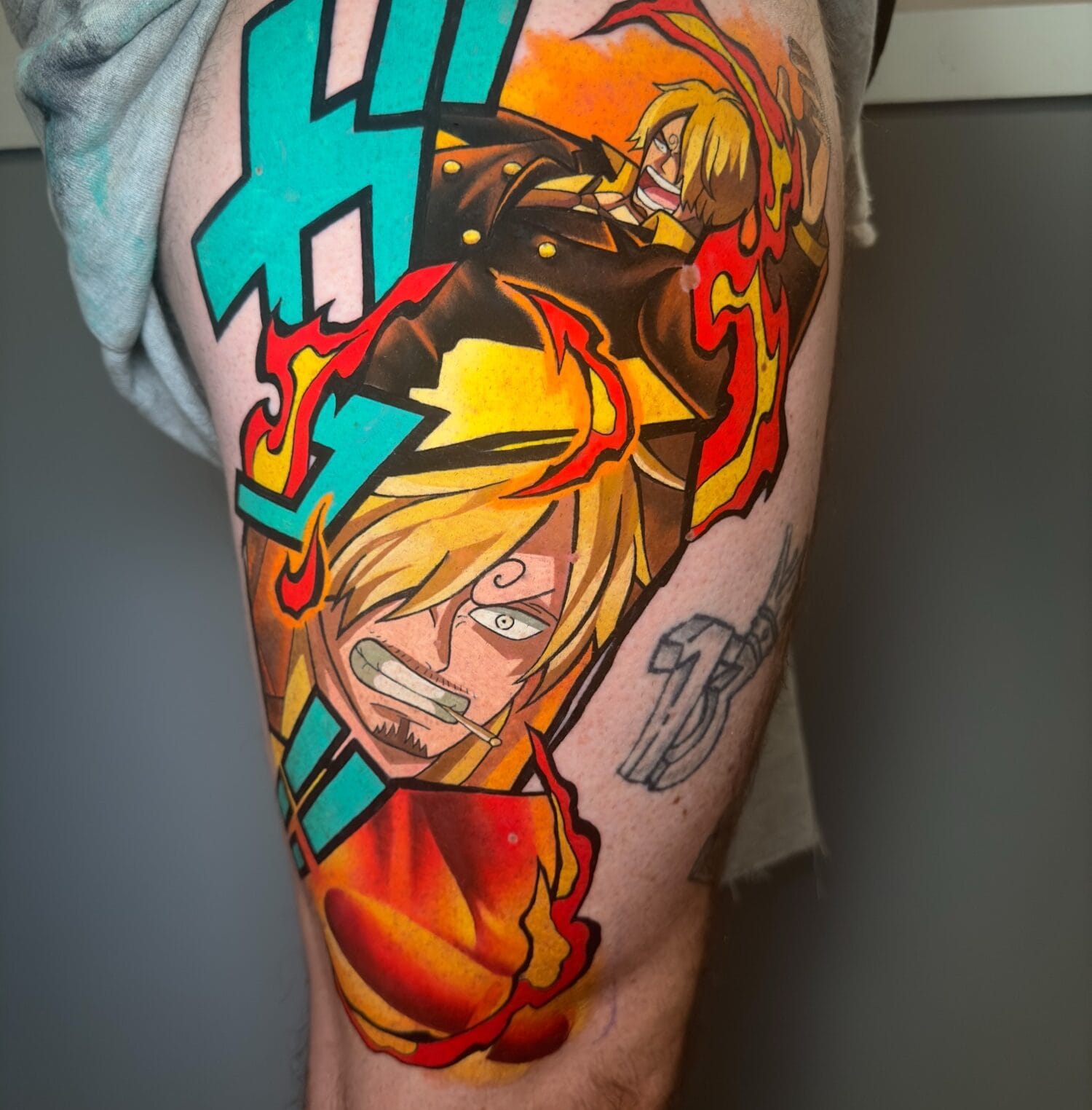 Vibrant Sanji Anime Tattoo on Thigh