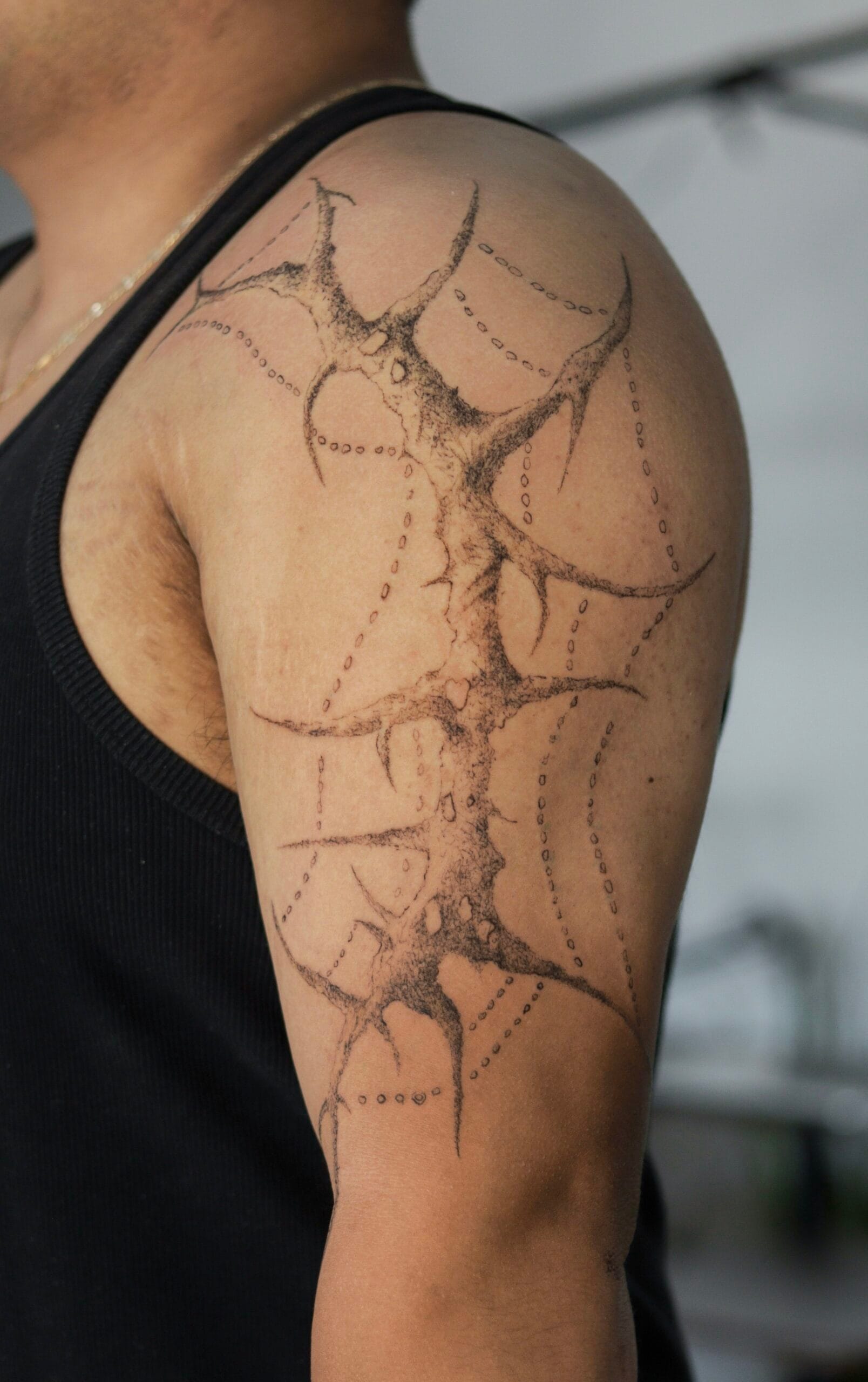 Shoulder abstract tattoo idea for men