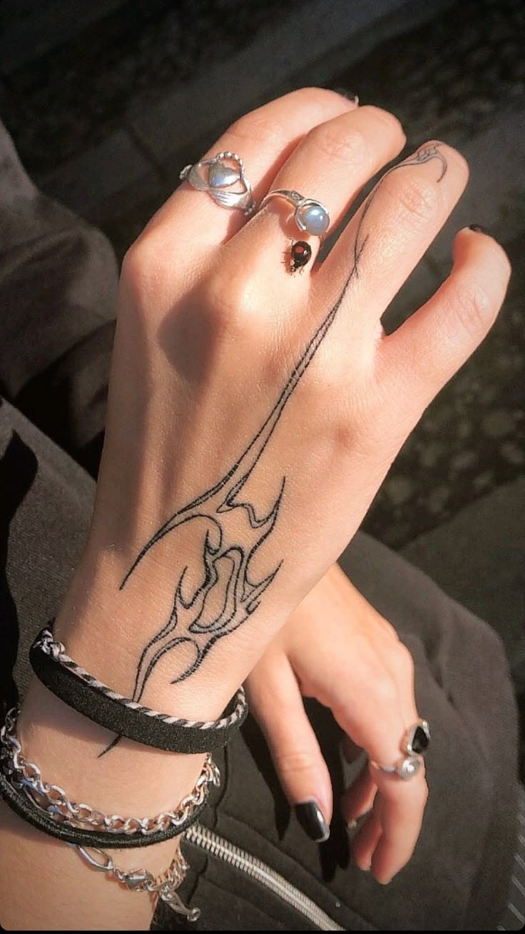 Minimalistic abstract tattoo on hand