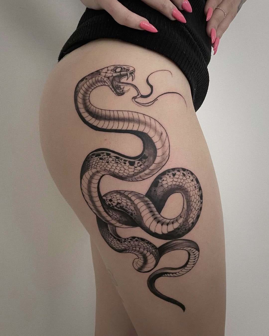 Black And Gray Snake Hip Tattoo