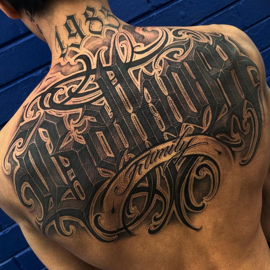 Back Tattoo With Strong Lettering