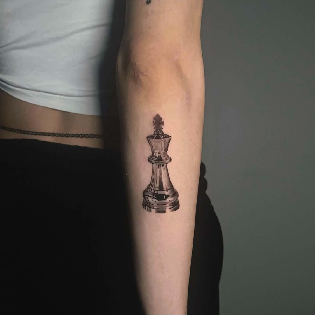 Chess King Tattoo On Arm In Black And Gray