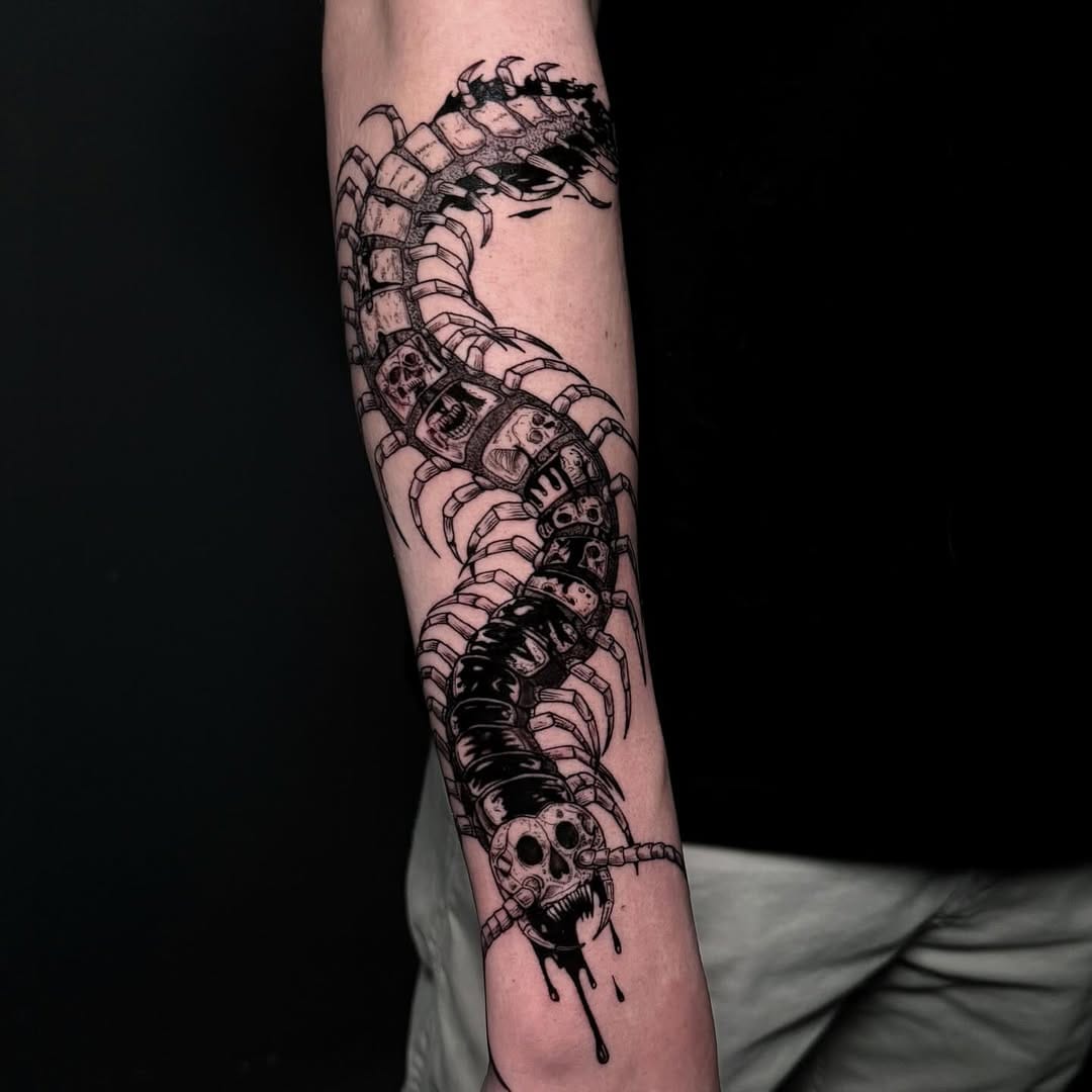 Dark Style Centipede Tattoo With Skull Details On Forearm
