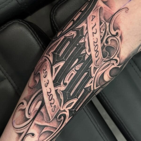 Mixed Script Lettering Forearm Tattoo