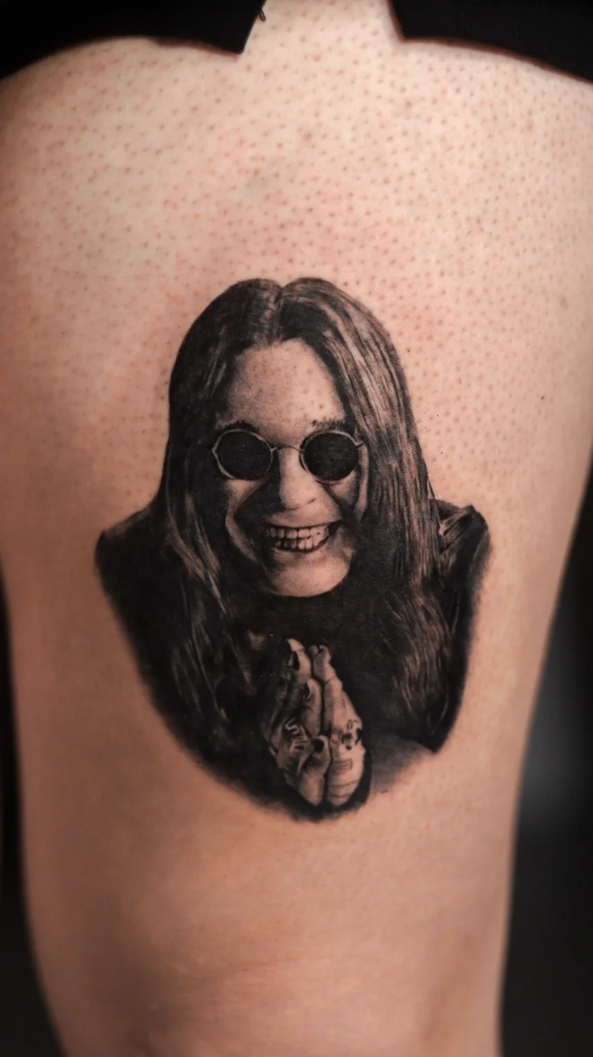black and gray Ozzy Osbourne portrait realism tattoo mid city