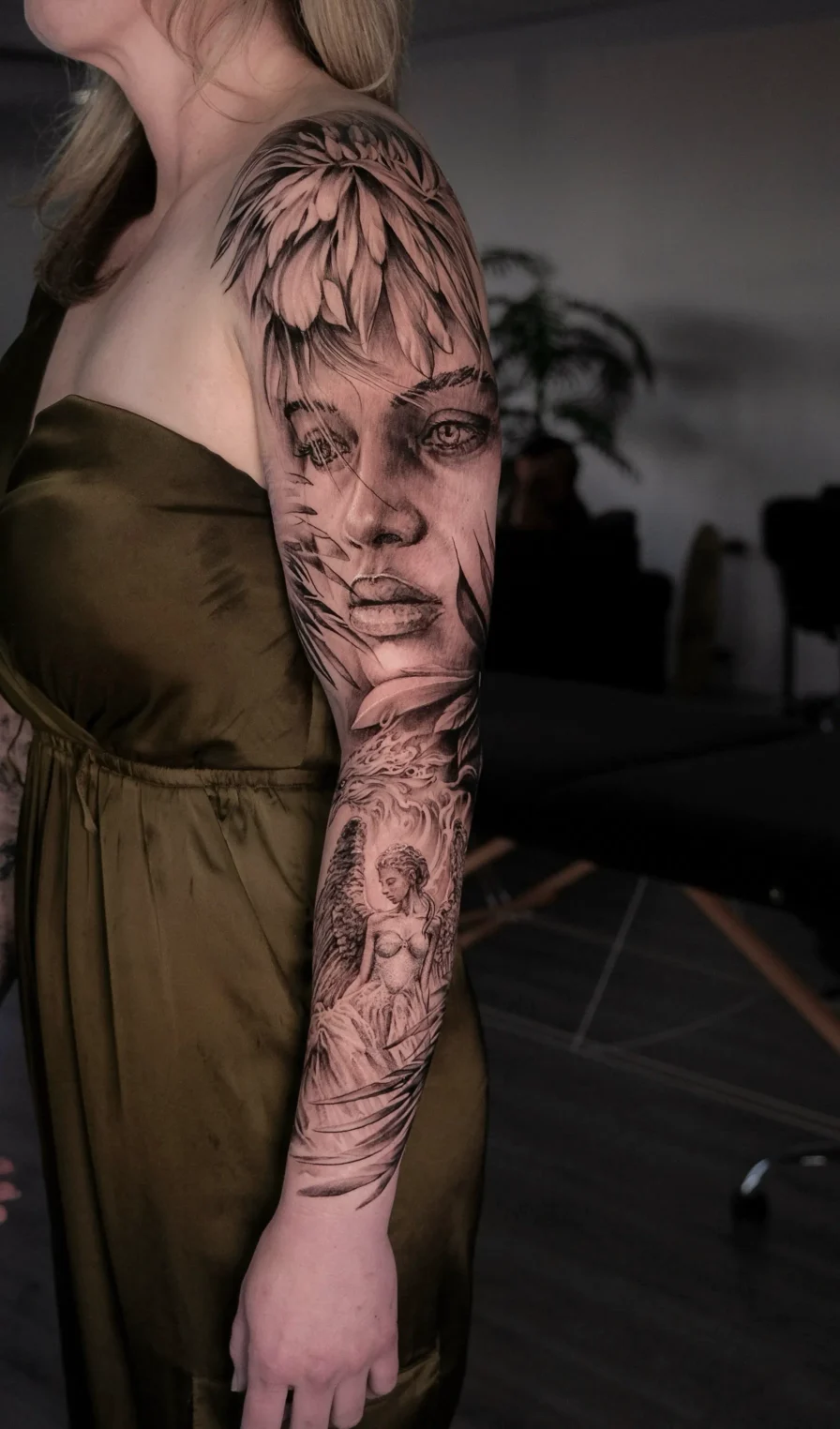 black and gray feather realism sleeve tattoo sawtelle