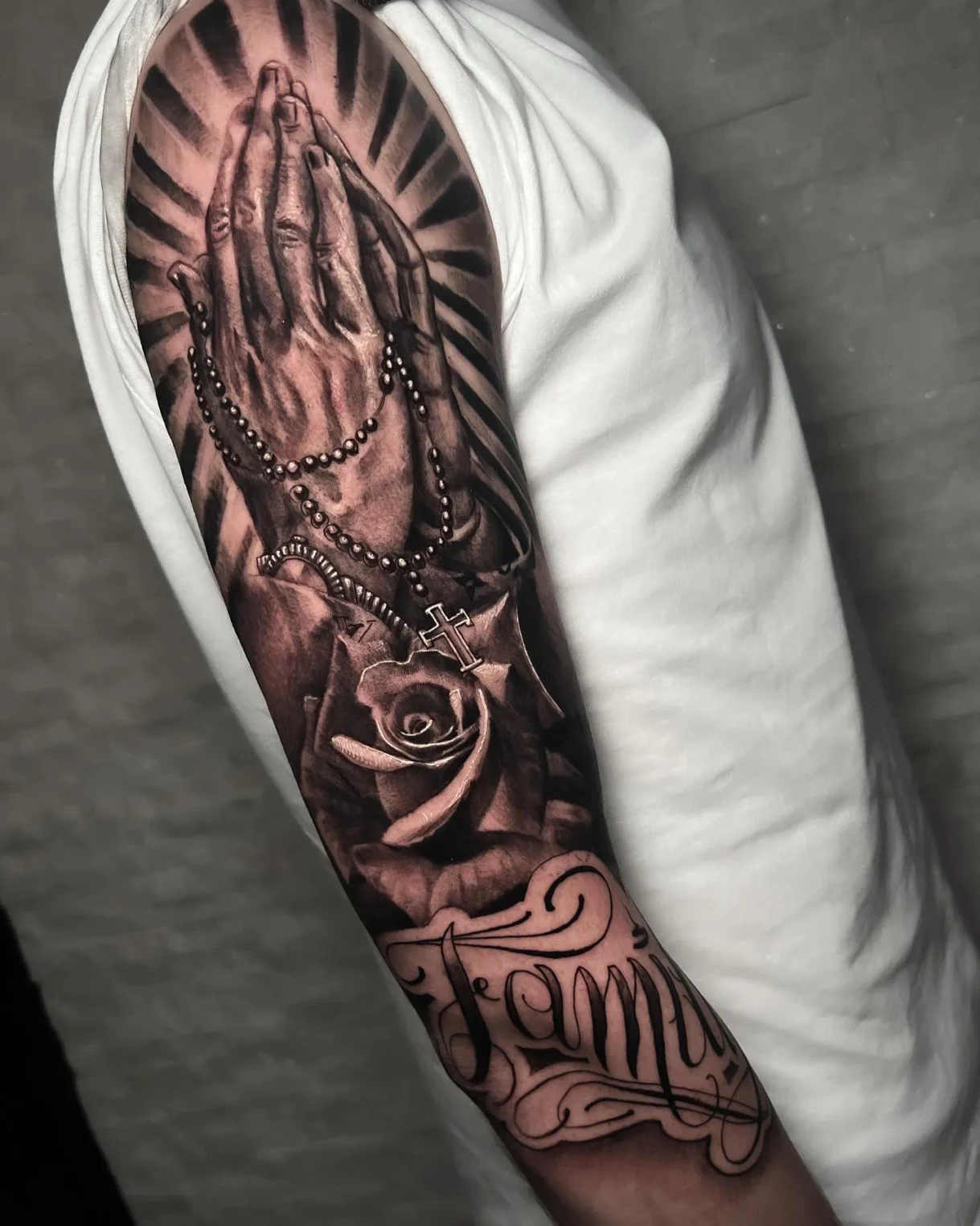 black and gray praying hands realism sleeve tattoo beverlywood