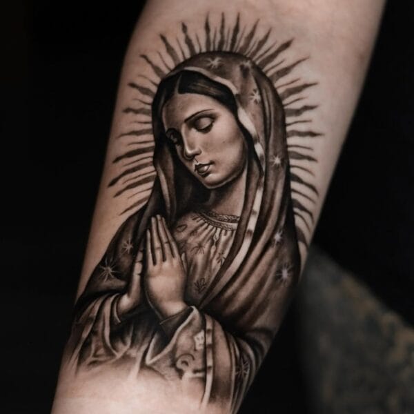 Religious Virgin Mary Tattoo On Forearm In Black And Gray