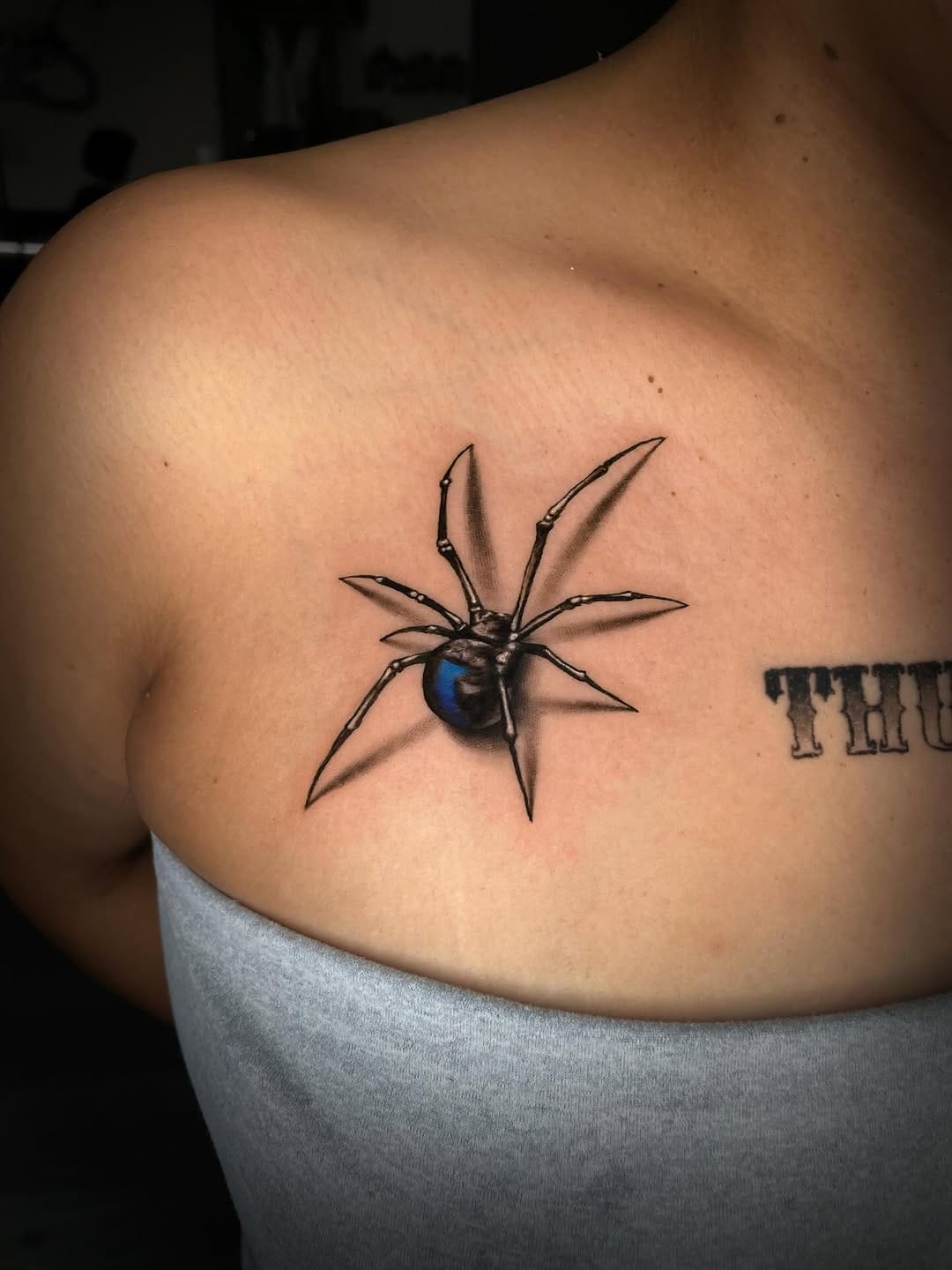 Realistic Spider Tattoo By Collarbone